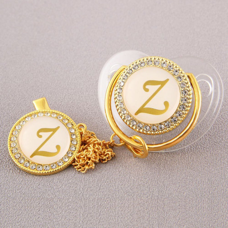 Set Ciuccio Trasparente e oro  Luxury con Clip – Personalizzato con Iniziale 6-12 mesi