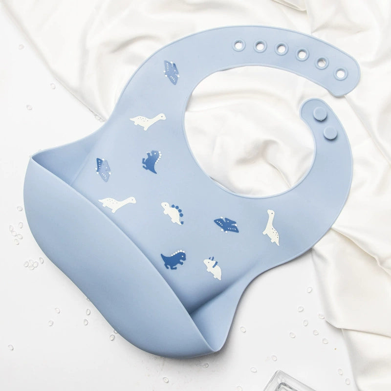 Bavetta in Silicone con Tasca – Dinosauri Azzurra, Antigoccia e Regolabile